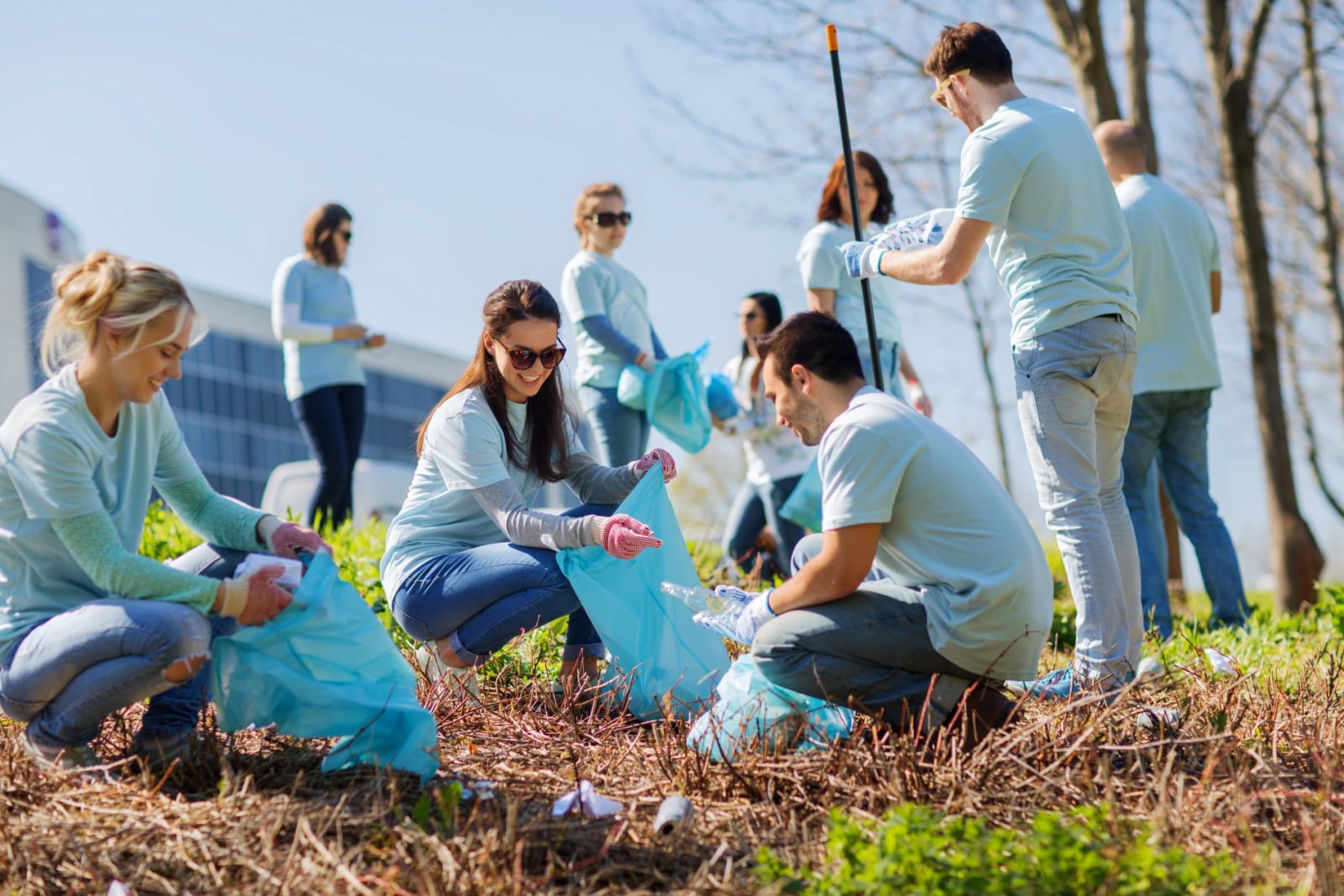 A group of volunteers picking up trash