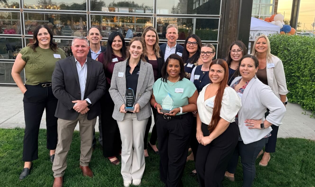 Group photo of Oak Valley COmmunity Bank employees holding the award for Best Places to Work in 2026
